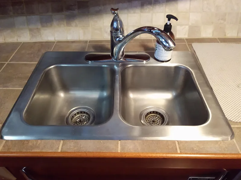 Slide: The Image of Stainless steel double sink with faucet on Tollycraft 43 Motoryacht, 1981 model. - 21