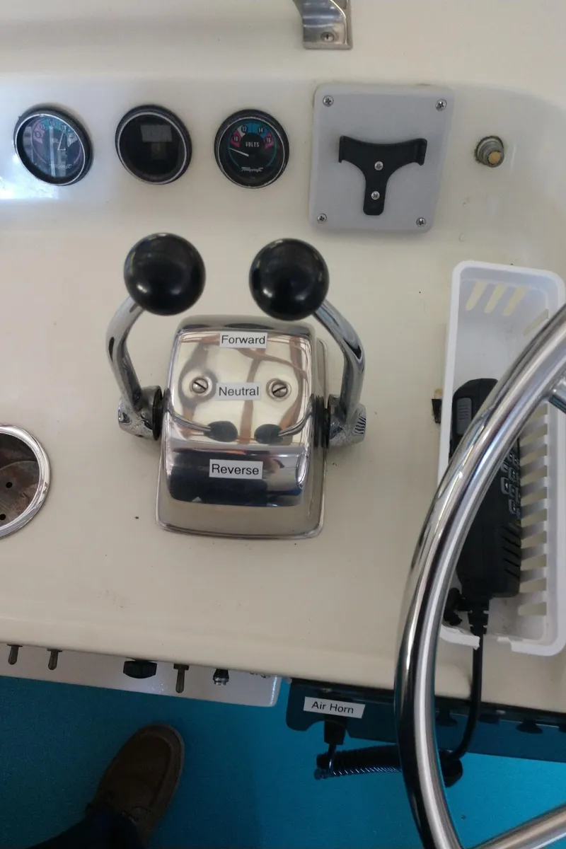 Slide: The Image of Control panel of a 1981 Tollycraft 43 Motoryacht with throttle levers and gauges. - 6