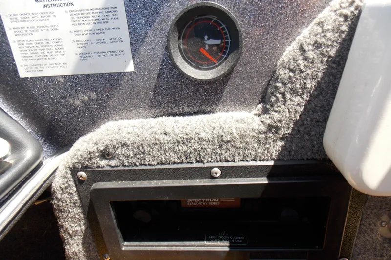 Slide: The Image of Dashboard of a 1990 MasterCraft 174 ZW boat with gauge and instructions. - 18