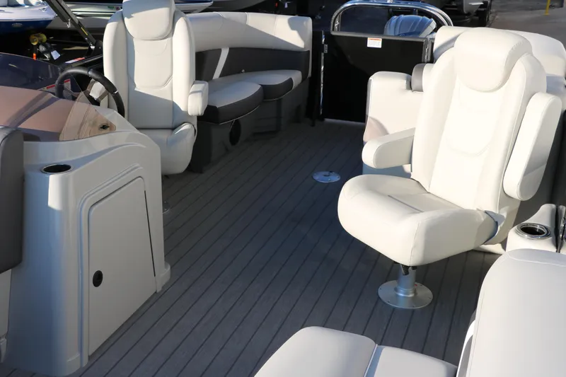 Slide: The Image of 2025 Sylvan Mirage X1 boat interior with plush seating and modern design. - 16