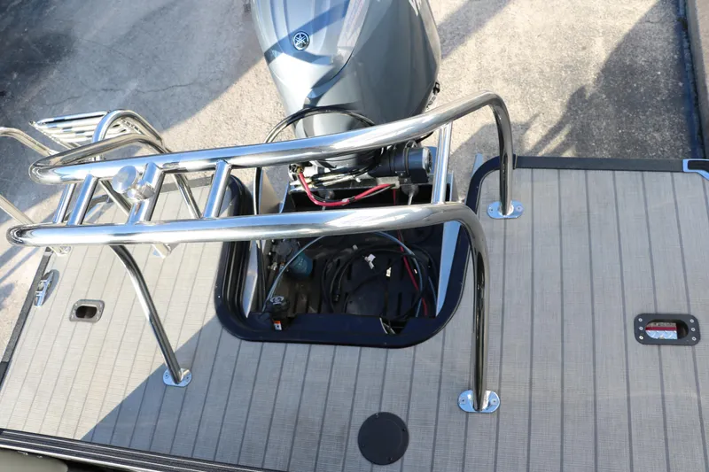 Slide: The Image of 2025 Sylvan Mirage X1 boat engine with stainless steel railing on deck. - 22