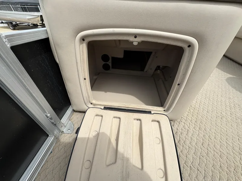 Slide: The Image of Open storage compartment on 2011 Sun Tracker PARTY BARGE 25 boat. - 15