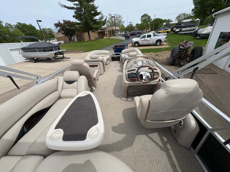 Slide: The Image of 2011 Sun Tracker PARTY BARGE 25 pontoon boat with spacious seating and modern dashboard. - 23