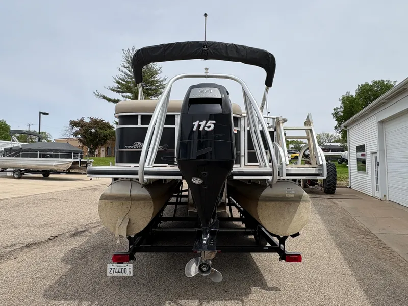 Slide: The Image of 2011 Sun Tracker PARTY BARGE 25 pontoon boat with 115 HP engine, parked on pavement. - 6