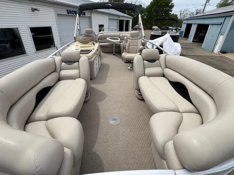 Slide: The Image of 2011 Sun Tracker PARTY BARGE 25 with spacious seating and beige upholstery. - 7