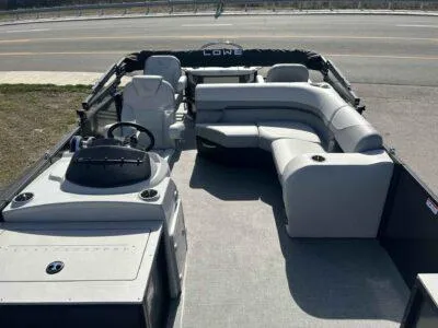 Slide: The Image of 2025 Lowe SF 214 pontoon boat with spacious seating and modern design. - 1