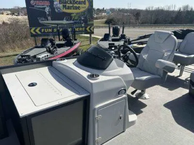 Slide: The Image of 2025 Lowe SF 214 boat interior with steering console and seating, displayed at BlackBeard Marine. - 3