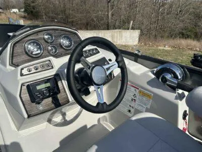 Slide: The Image of Steering console of 2025 Lowe SF 214 boat with gauges and controls. - 4