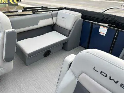 Slide: The Image of 2025 Lowe LS 210 WT boat interior with gray seating and modern design. - 8