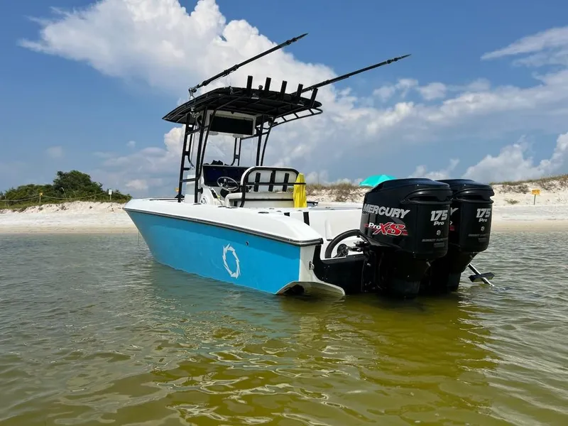 Slide: The Image of 2006 Fountain 23 Tournament CC boat with dual Mercury engines in shallow water. - 0