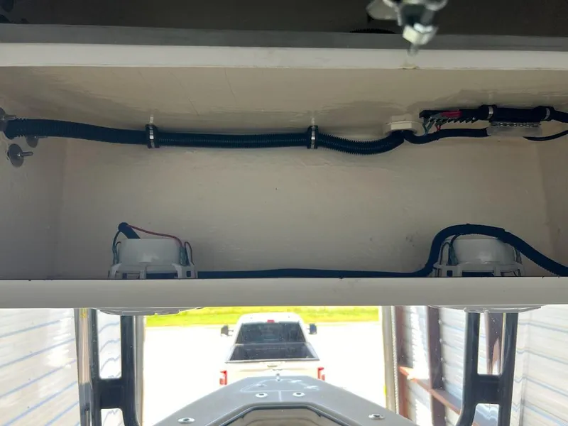 Slide: The Image of 2006 Fountain 23 Tournament CC boat wiring and storage compartment view. - 10