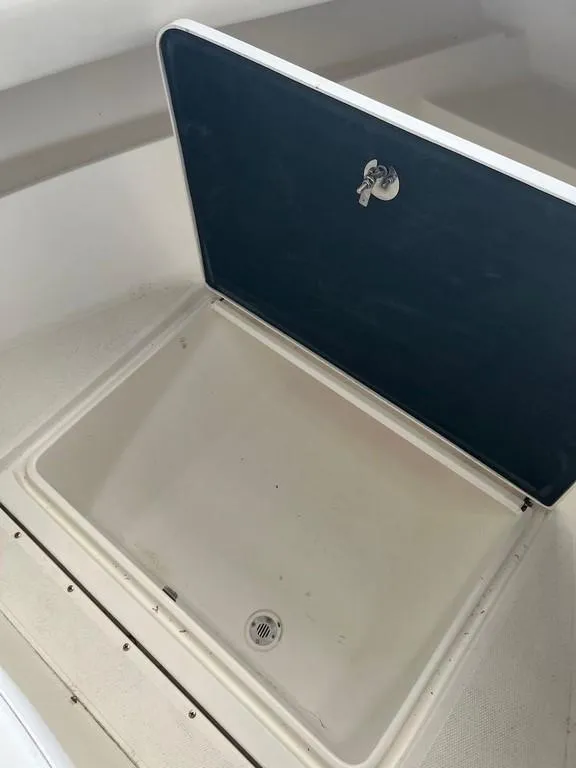 Slide: The Image of Open storage compartment on 2006 Fountain 23 Tournament CC boat. - 11