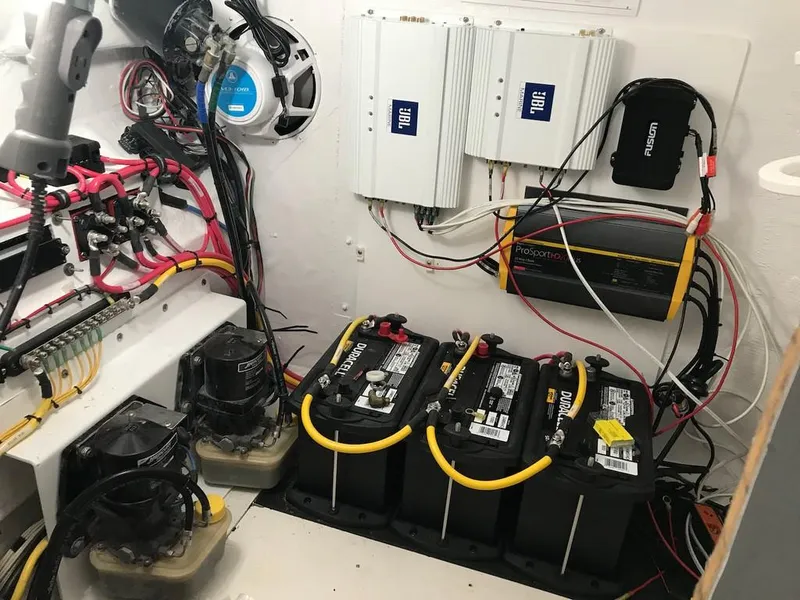 Slide: The Image of Electrical system setup in a 2006 Fountain 23 Tournament CC boat, featuring batteries and wiring. - 4