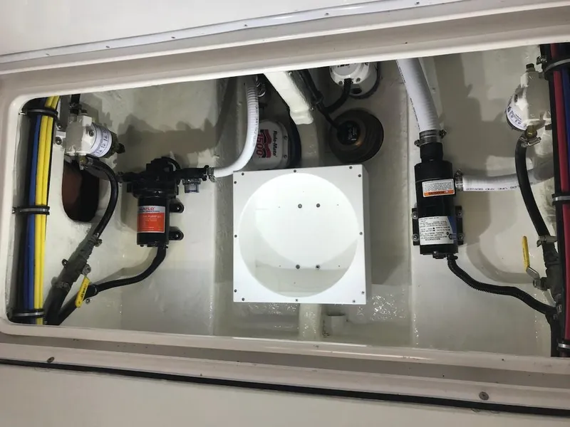 Slide: The Image of 2006 Fountain 23 Tournament CC boat interior with visible plumbing and wiring components. - 6