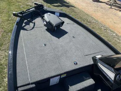 Slide: The Image of 2025 Lowe Stinger 195 Bass boat deck with trolling motor and storage compartments. - 9