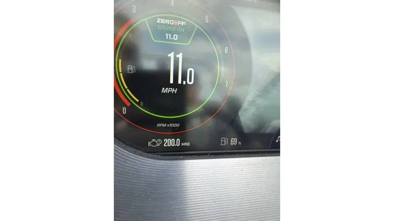 Slide: The Image of Dashboard display of 2023 MasterCraft XT22 showing 11.0 MPH speed and 200.0 engine hours. - 5