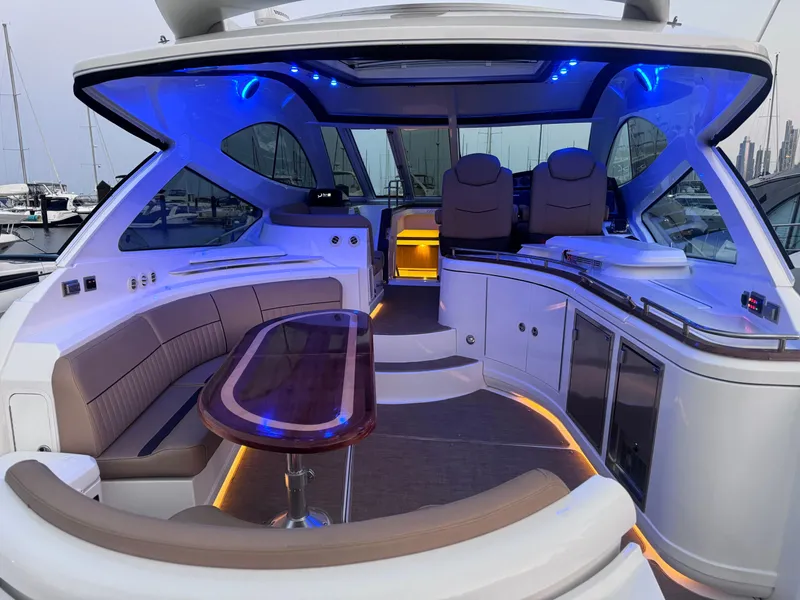 Slide: The Image of Luxurious 2014 Cruisers Yachts 54 Sport Coupe interior with ambient blue lighting. - 15
