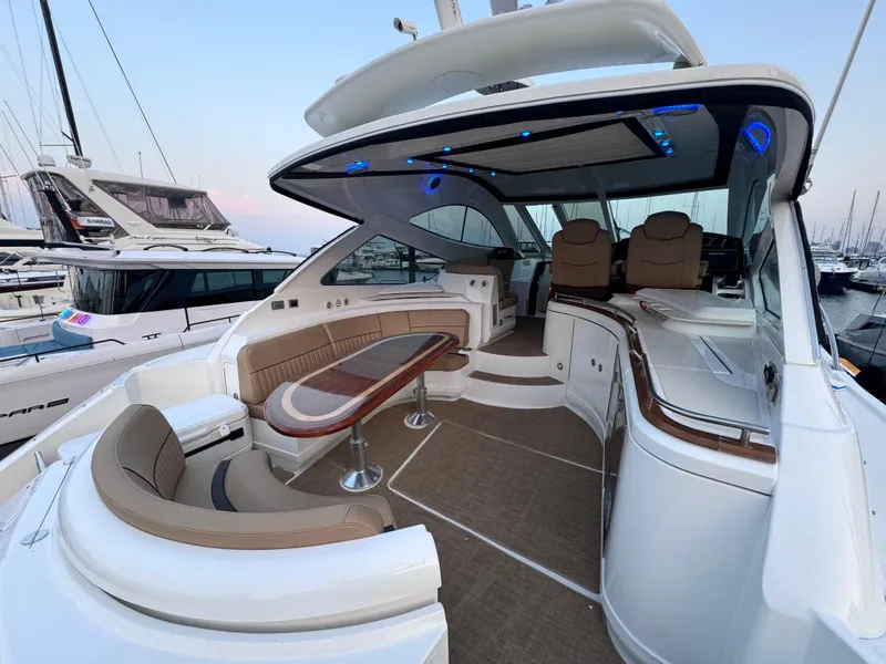 Slide: The Image of Luxurious 2014 Cruisers Yachts 54 Sport Coupe interior with elegant seating and modern design. - 18