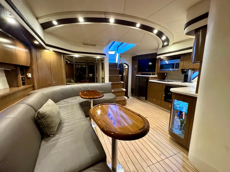 Slide: The Image of Luxurious interior of 2014 Cruisers Yachts 54 Sport Coupe with modern furnishings and elegant design. - 23
