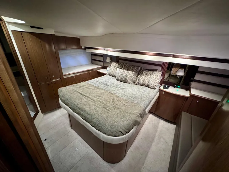 Slide: The Image of Luxurious bedroom interior of 2014 Cruisers Yachts 54 Sport Coupe with elegant wood finish. - 26