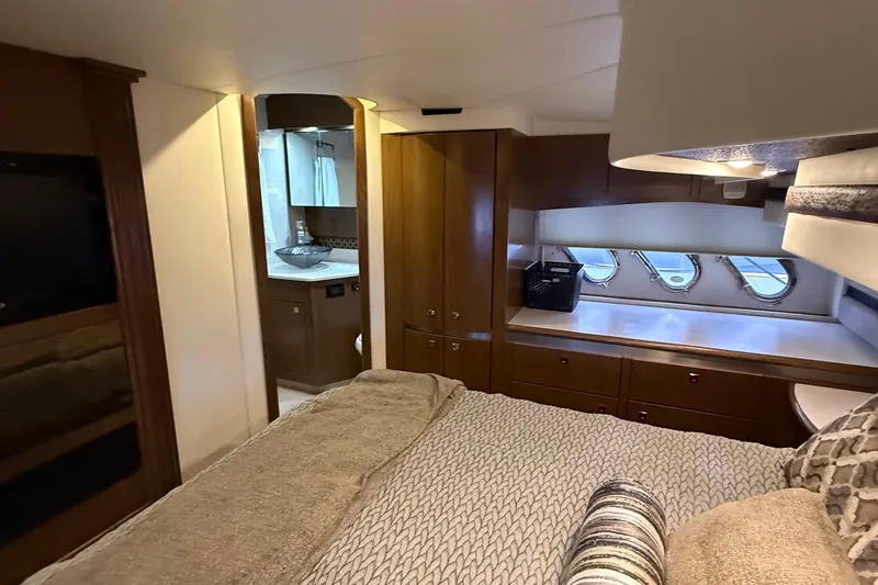 Slide: The Image of Luxurious interior of 2014 Cruisers Yachts 54 Sport Coupe with elegant wood finishes. - 43