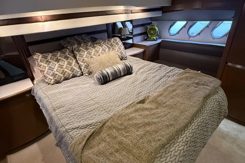 Slide: The Image of Luxurious bedroom interior of 2014 Cruisers Yachts 54 Sport Coupe with elegant bedding. - 44