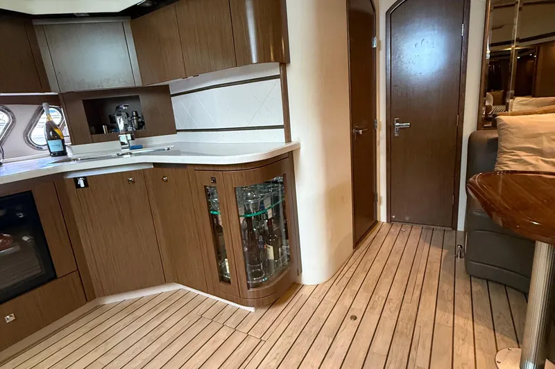 Slide: The Image of Luxurious interior of 2014 Cruisers Yachts 54 Sport Coupe with modern kitchen amenities. - 47