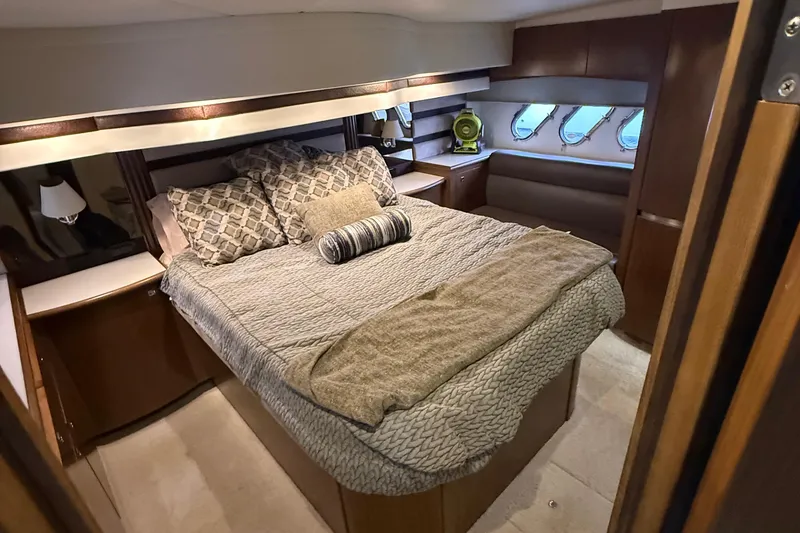Slide: The Image of Luxurious bedroom interior of 2014 Cruisers Yachts 54 Sport Coupe with elegant bedding. - 55