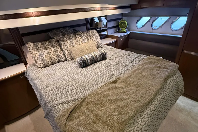 Slide: The Image of Luxurious bedroom interior of 2014 Cruisers Yachts 54 Sport Coupe with elegant bedding. - 58