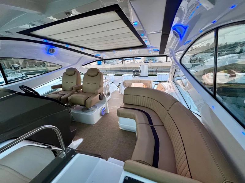 Slide: The Image of Luxurious interior of 2014 Cruisers Yachts 54 Sport Coupe with plush seating and modern design. - 14