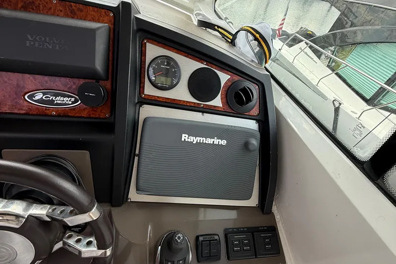 Slide: The Image of Control panel of 2014 Cruisers Yachts 54 Sport Coupe with Raymarine and Volvo Penta systems. - 38