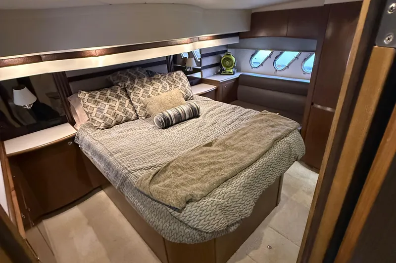 Slide: The Image of Luxurious bedroom interior of 2014 Cruisers Yachts 54 Sport Coupe with elegant bedding. - 45