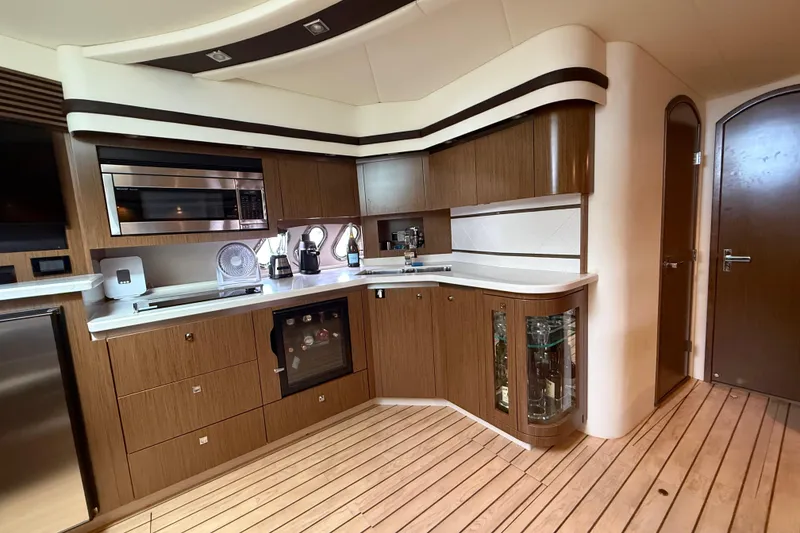 Slide: The Image of Luxurious kitchen interior of 2014 Cruisers Yachts 54 Sport Coupe with modern appliances. - 46