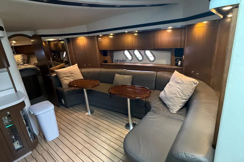 Slide: The Image of Luxurious interior of 2014 Cruisers Yachts 54 Sport Coupe with leather seating and wooden accents. - 48