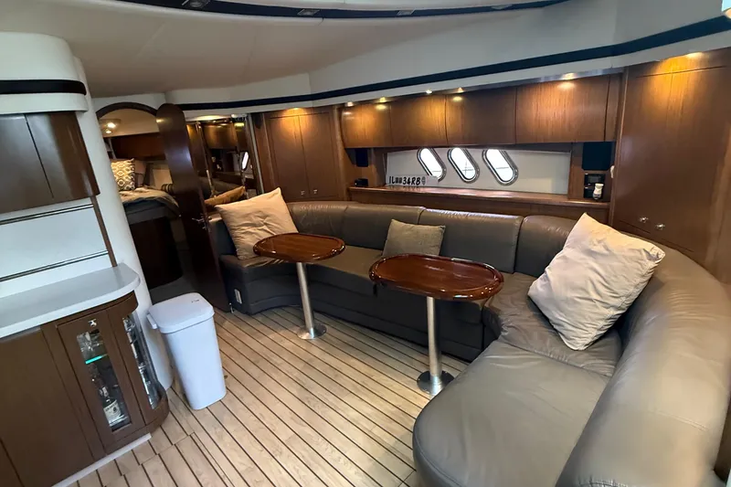 Slide: The Image of Luxurious interior of 2014 Cruisers Yachts 54 Sport Coupe with elegant seating and wood accents. - 49