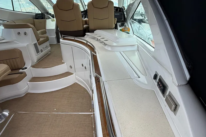 Slide: The Image of 2014 Cruisers Yachts 54 Sport Coupe interior with luxurious seating and modern dashboard. - 50