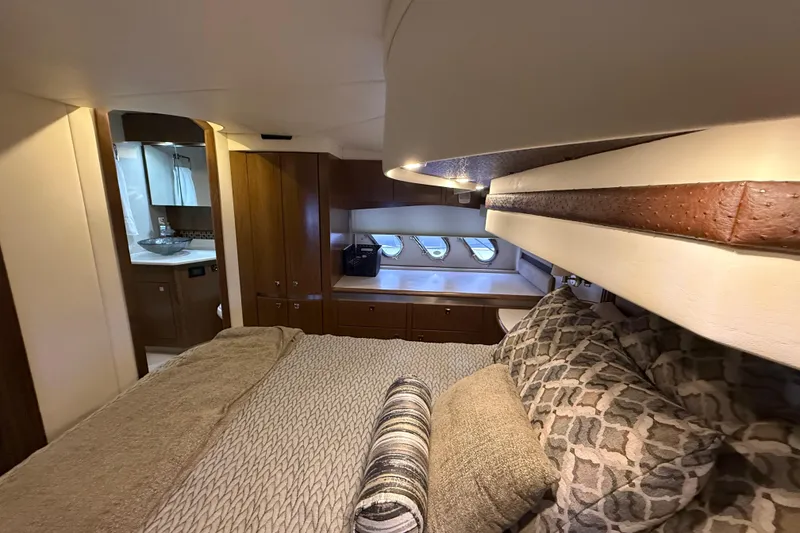 Slide: The Image of Luxurious interior of 2014 Cruisers Yachts 54 Sport Coupe with cozy bedroom and elegant decor. - 59