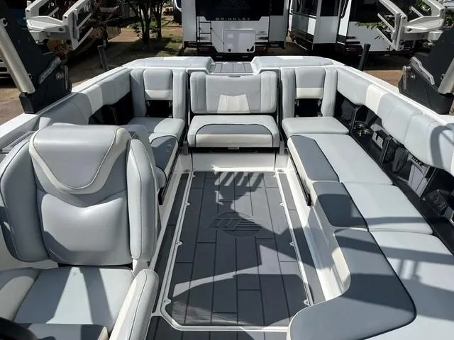 Slide: The Image of 2023 Malibu Wakesetter 24 MXZ interior with spacious seating and modern design. - 13
