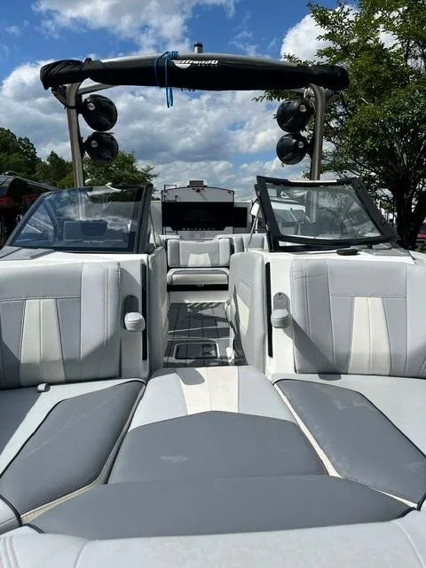 Slide: The Image of 2023 Malibu Wakesetter 24 MXZ boat interior with sleek seating and wakeboard tower. - 15