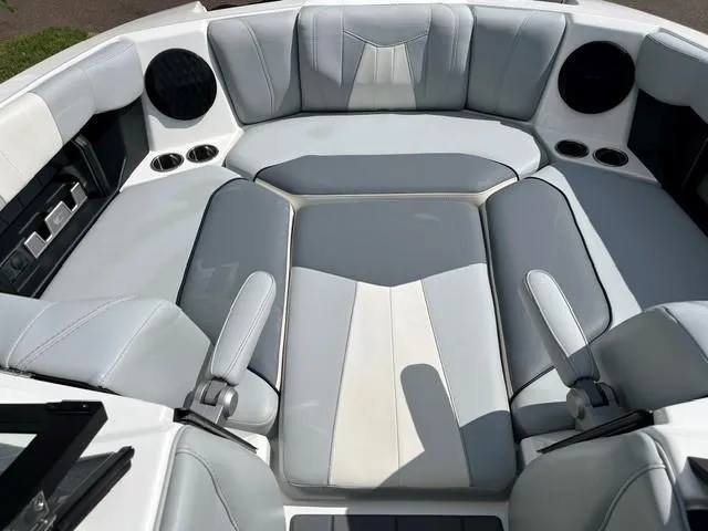 Slide: The Image of 2023 Malibu Wakesetter 24 MXZ interior with spacious seating and modern design. - 16