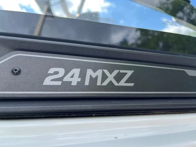 Slide: The Image of 2023 Malibu Wakesetter 24 MXZ logo on boat exterior. - 5