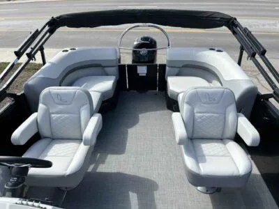 Slide: The Image of 2025 Lowe SS 230 WT pontoon boat interior with plush seating and modern design. - 10