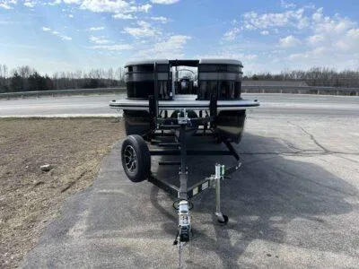 Slide: The Image of 2025 Lowe SS 230 WT boat on trailer under a clear blue sky. - 4
