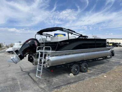 Slide: The Image of 2025 Lowe SS 230 WT pontoon boat on trailer under a cloudy sky. - 5