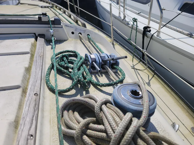 Slide: The Image of Deck of 1977 Islander 27 sailboat with ropes and winch. - 9