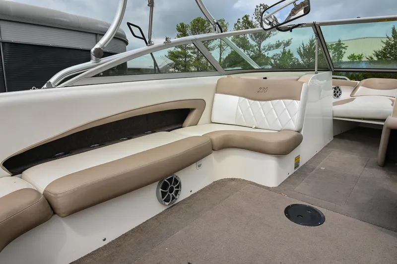 Slide: The Image of 2001 MasterCraft MariStar 230 boat interior with beige seating and modern design. - 13