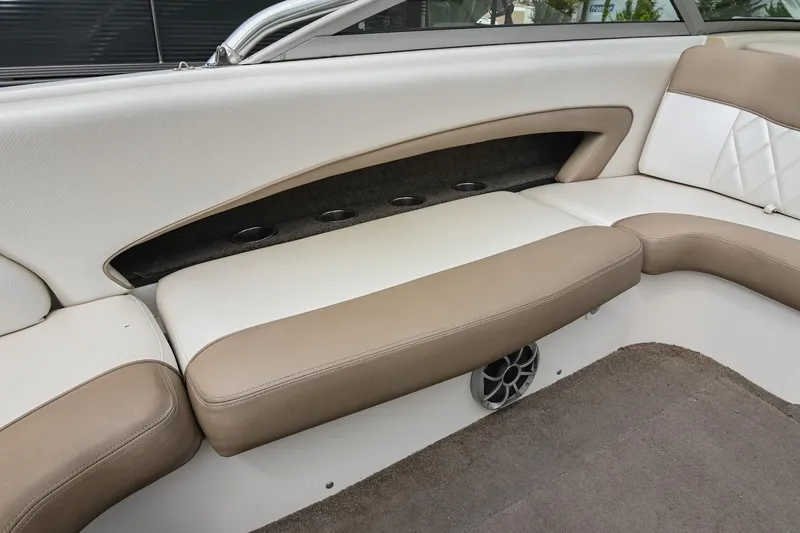Slide: The Image of 2001 MasterCraft MariStar 230 boat interior with beige and white seating. - 14