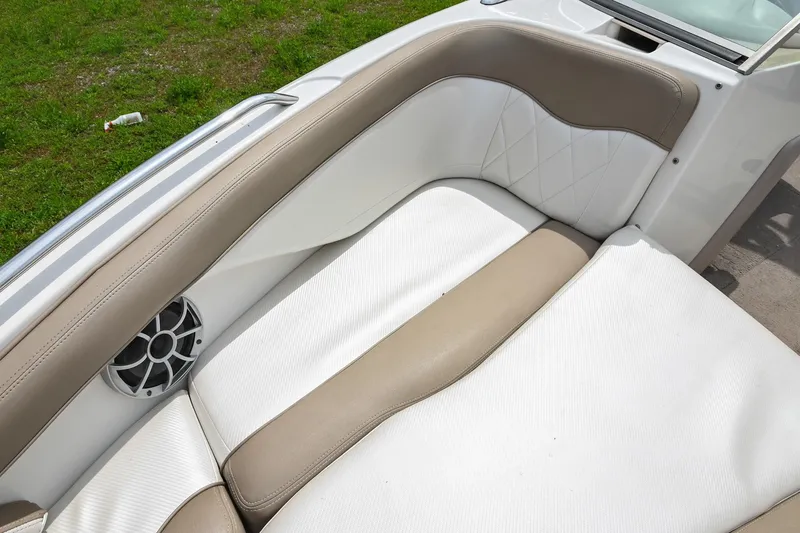 Slide: The Image of 2001 MasterCraft MariStar 230 boat interior with beige and white seating, speaker detail. - 25