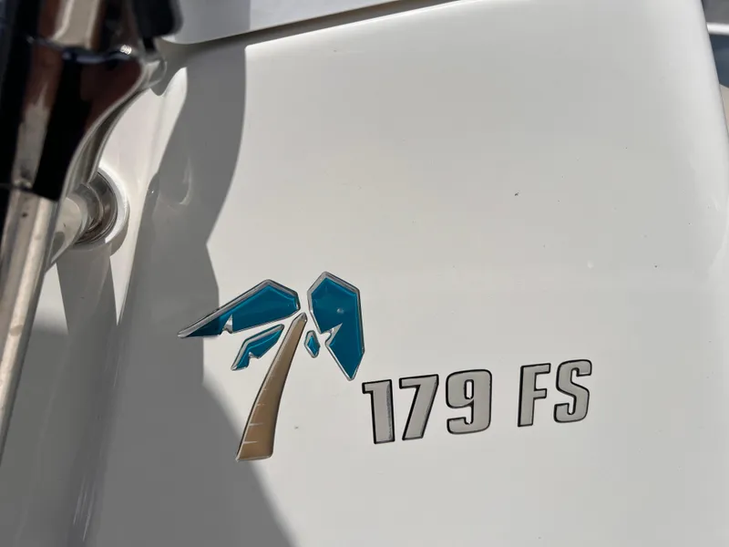 Slide: The Image of 2025 Key West 179 FS boat logo on white surface. - 12