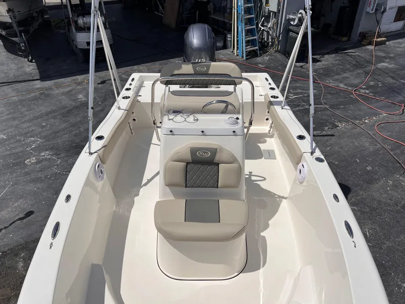 Slide: The Image of 2025 Key West 179 FS boat interior with seating and steering console. - 14